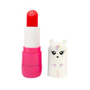 Balsamul de buze Zoomania Inuwet cu aromă de cireșe, deschis, alături de capacul unicorn