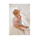 Baby wearing a LÄSSIG cotton bodysuit