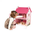 Child exploring the Mademoiselle doll’s house — Janod
