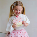 Fustița tutu Cutesy Bow purtată cu o geantă în formă de prăjitură
