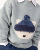 Pulover din lână merino Denn Urs polar, Cloud Blue Melange – copil purtând puloverul, detaliu frontal
