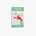 Cutia puzzle-ului 3D Rac de râu lângă figurina montată