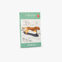 Cutia puzzle-ului 3D Ghepard lângă figurina montată