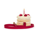 Spatele genții Birthday Cake, cu breteaua roșie așezată în jur
