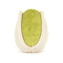 Spatele fisticului Horatio Pistachio, cu miezul verde între cele două jumătăți de coajă